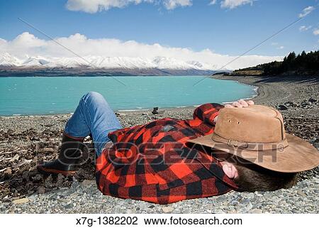 Young farmer at Lake Pukaki, South Island of New Zealand View Large Photo Image Stock Image - Young farmer at Lake Pukaki, South Island of New Zealand. Fotosearch
