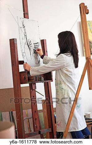 Young female art student drawing View Large Photo Image Stock Photo - Young female art student drawing. Fotosearch