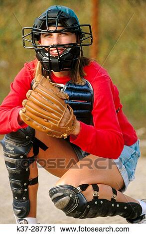 Young female baseball catcher playing game on field View Large Photo Image Stock Image - Young female baseball catcher playing game on field. Fotosearch