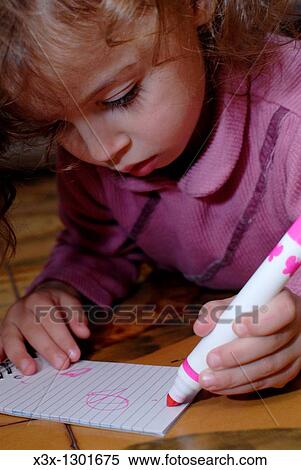Young female child drawing with markers View Large Photo Image Stock Photography - Young female child drawing with markers. Fotosearch