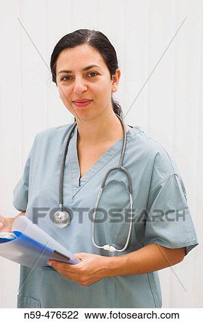 Young female medical professional smiling. View Large Photo Image Stock Image - Young female medical professional smiling.. Fotosearch