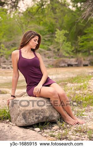 Young female model barefoot in natural setting close to a river View Large Photo Image Stock Photography - Young female model barefoot in natural setting close to a river. Fotosearch