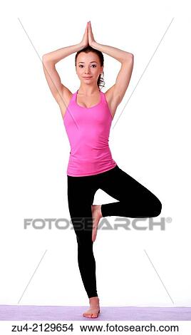 Young female model performing yoga asanas. View Large Photo Image Picture - Young female model performing yoga asanas.. Fotosearch