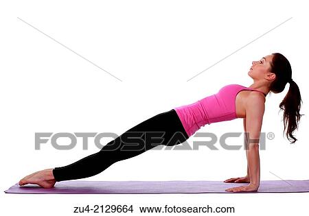 Young female model performing yoga asanas. View Large Photo Image Picture - Young female model performing yoga asanas.. Fotosearch