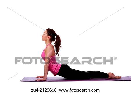 Young female model performing yoga asanas. View Large Photo Image Stock Photo - Young female model performing yoga asanas.. Fotosearch