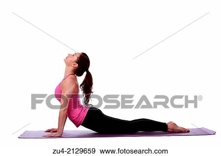 Young female model performing yoga asanas. View Large Photo Image Stock Photo - Young female model performing yoga asanas.. Fotosearch