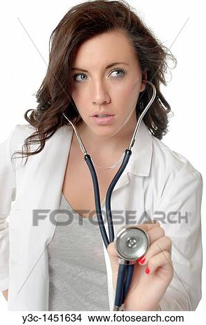 Young female physician performing auscultation View Large Photo Image Picture - Young female physician performing auscultation. Fotosearch