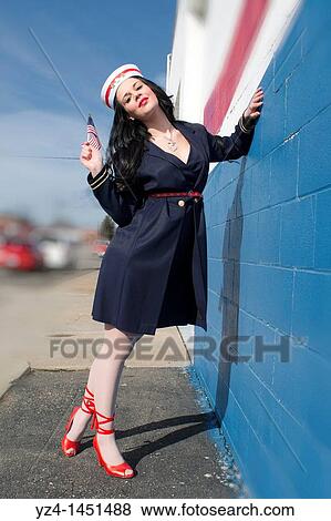Stock Photo - Young female posing for independence day 4th of July USA. Fotosearch
