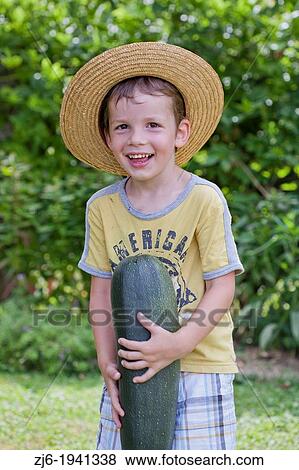 Young gardener with harvested vegetables. View Large Photo Image Stock Photo - Young gardener with harvested vegetables.. Fotosearch