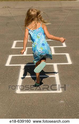 Young girl, 4 years old, playing hopscotch in park. White Rock, BC, Canada. Near Vancouver View Large Photo Image Stock Image - Young girl, 4 years old, playing hopscotch in park. White Rock, BC, Canada. Near Vancouver. Fotosearch