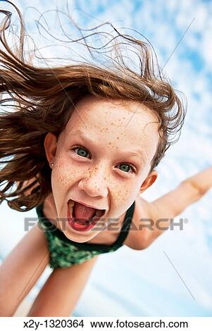 Young girl at the beach View Large Photo Image Picture - Young girl at the beach. Fotosearch
