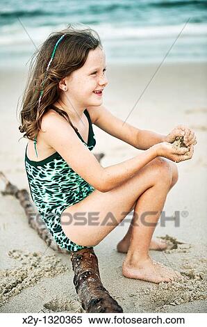 Young girl at the beach View Large Photo Image Stock Photography - Young girl at the beach. Fotosearch