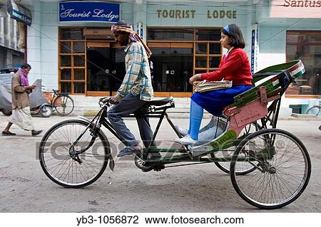 Young girl being taken to school by bicycle taxi, Delhi, India View Large Photo Image Stock Image - Young girl being taken to school by bicycle taxi, Delhi, India. Fotosearch