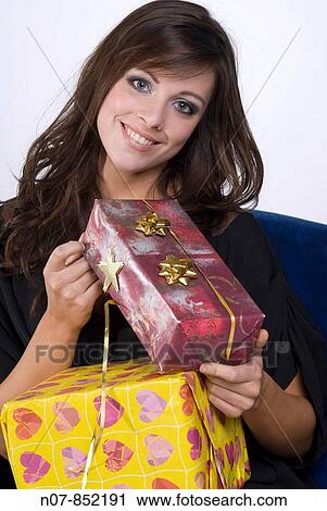 Young girl carrying gifts View Large Photo Image Stock Image - Young girl carrying gifts. Fotosearch
