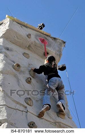Young girl climbs wall at Strawberry Festival Plant City Florida View Large Photo Image Stock Image - Young girl climbs wall at Strawberry Festival Plant City Florida. Fotosearch