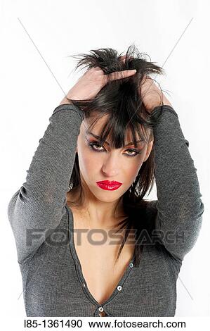 Young girl clutching her hair View Large Photo Image Stock Image - Young girl clutching her hair. Fotosearch