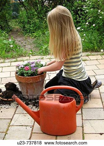 Stock Photo - Young girl doing gardening.. Fotosearch
