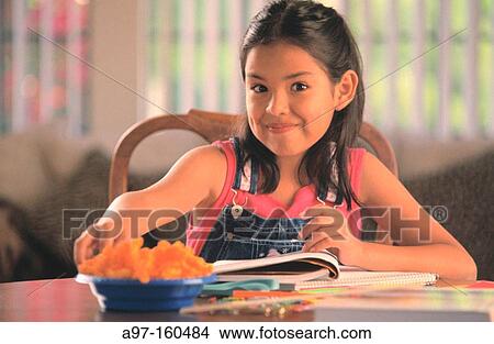 Young girl doing homework View Large Photo Image Picture - Young girl doing homework. Fotosearch