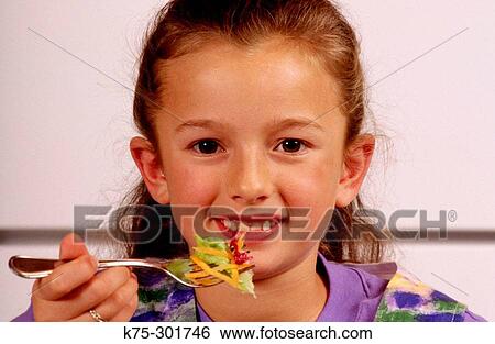 young girl eating salad View Large Photo Image Stock Photograph - young girl eating salad. Fotosearch