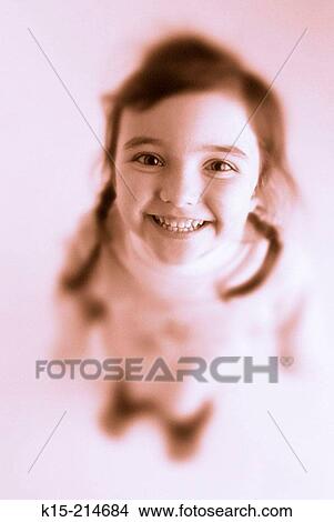Young girl grinning at camera View Large Photo Image Picture - Young girl grinning at camera. Fotosearch