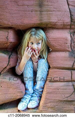 young girl happy playing hide and seek, cleveleys, lancashire, england, uk, europe. View Large Photo Image Stock Photography - young girl happy playing hide and seek, cleveleys, lancashire, england, uk, europe.. Fotosearch