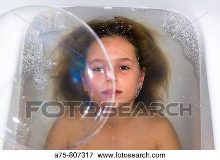young girl having a bath View Large Photo Image Stock Photo - young girl having a bath. Fotosearch