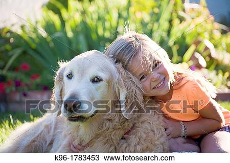 young girl hugging family dog View Large Photo Image Stock Image - young girl hugging family dog. Fotosearch