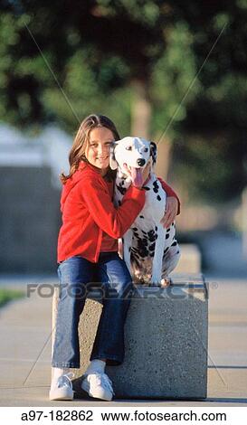Young girl hugs her dog View Large Photo Image Stock Image - Young girl hugs her dog. Fotosearch