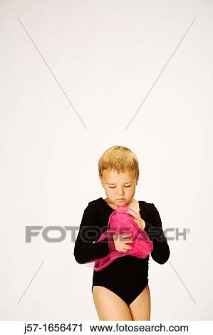 Young girl in a black leotard with pediatric cancer leukimia playing with fabric in the studio View Large Photo Image Stock Image - Young girl in a black leotard with pediatric cancer leukimia playing with fabric in the studio. Fotosearch