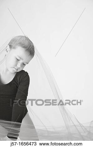 Young girl in a black leotard with pediatric cancer leukimia playing with fabric in the studio View Large Photo Image Stock Image - Young girl in a black leotard with pediatric cancer leukimia playing with fabric in the studio. Fotosearch