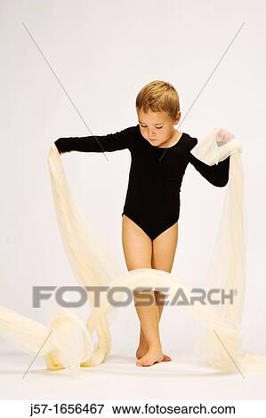 Young girl in a black leotard with pediatric cancer playing in studio with scarf View Large Photo Image Stock Photo - Young girl in a black leotard with pediatric cancer playing in studio with scarf. Fotosearch