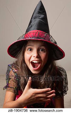 Stock Photograph - Young girl in a witch costume. Fotosearch