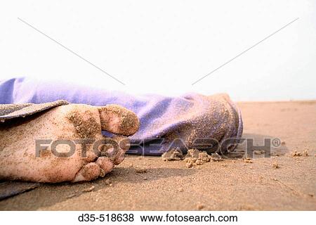 Young girl in blue sandy slack laying on beach View Large Photo Image Stock Photo - Young girl in blue sandy slack laying on beach. Fotosearch