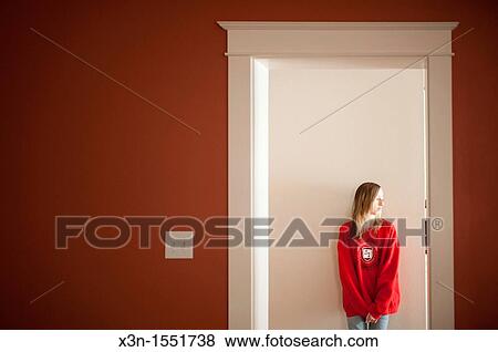 Young girl in doorway of a home View Large Photo Image Stock Photo - Young girl in doorway of a home. Fotosearch