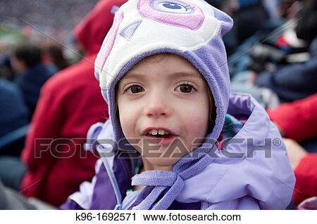 Stock Image - young girl in purple hat. Fotosearch