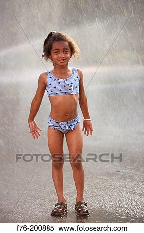 Young girl in sprinkler View Large Photo Image Stock Photography - Young girl in sprinkler. Fotosearch
