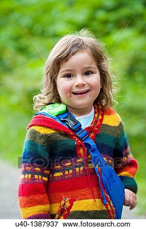 Stock Photo - Young girl in sweater. Fotosearch
