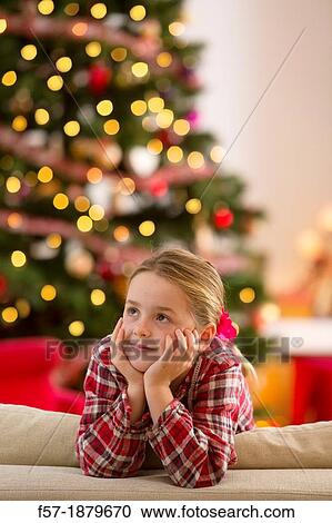 Young girl looking forward for Christmas View Large Photo Image Stock Image - Young girl looking forward for Christmas. Fotosearch
