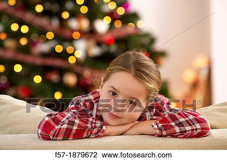 Stock Image - Young girl looking forward for Christmas. Fotosearch