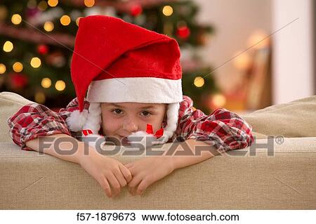 Stock Image - Young girl looking forward for Christmas. Fotosearch