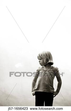 Young girl looking to the side with a sad face View Large Photo Image Stock Image - Young girl looking to the side with a sad face. Fotosearch
