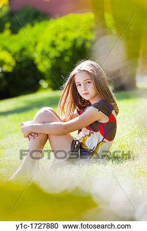 Stock Image - Young girl on a meadow. Fotosearch