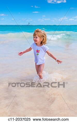 young girl on beach, Riu Palace, hotel, Punta Cana, Dominican Republic, Caribbean View Large Photo Image Stock Photography - young girl on beach, Riu Palace, hotel, Punta Cana, Dominican Republic, Caribbean. Fotosearch