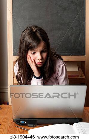 Stock Photograph - Young girl on computer. Fotosearch