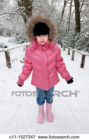 young girl out in Winter snow, Kent, England, UK View Large Photo Image Stock Photo - young girl out in Winter snow, Kent, England, UK. Fotosearch