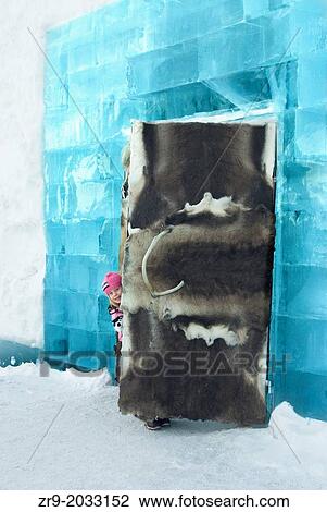 Young girl peeking out from a fur-covered door of the ice hotel in Sweden. View Large Photo Image Stock Image - Young girl peeking out from a fur-covered door of the ice hotel in Sweden.. Fotosearch
