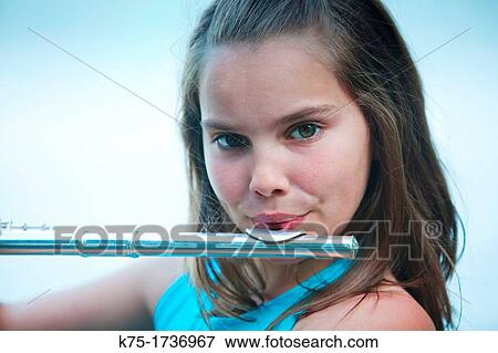 young girl playing flute View Large Photo Image Stock Photo - young girl playing flute. Fotosearch