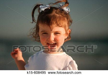Young girl playing on beach View Large Photo Image Stock Photography - Young girl playing on beach. Fotosearch