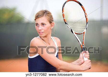 Young girl playing tennis View Large Photo Image Stock Image - Young girl playing tennis. Fotosearch