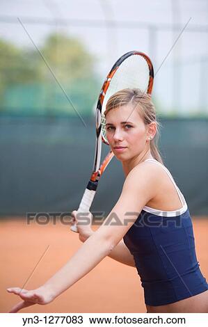 Young girl playing tennis View Large Photo Image Stock Image - Young girl playing tennis. Fotosearch